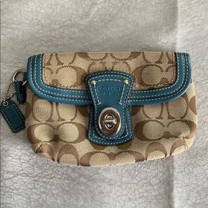 Brown Coach wristlet with Blue Trim